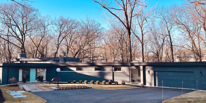 A house with trees in the background
