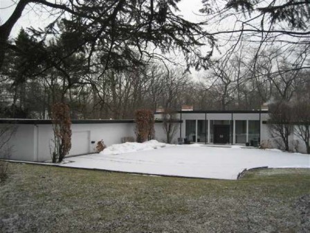 A house with snow on the ground
