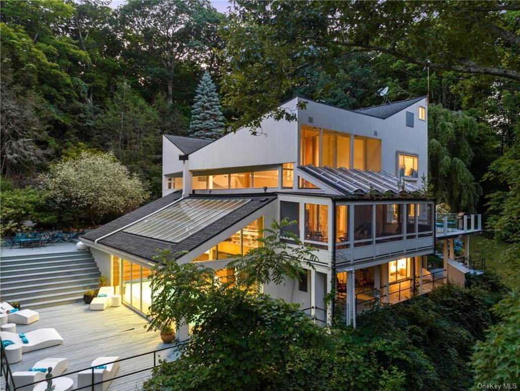 A large house with trees around it
