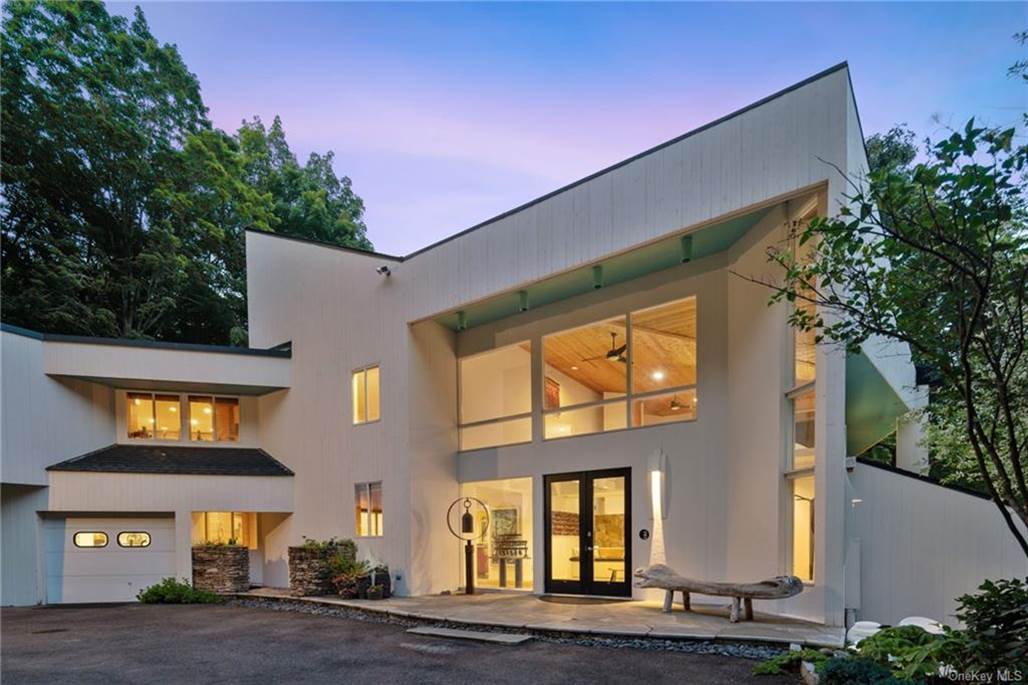 A large white house with a large front door
