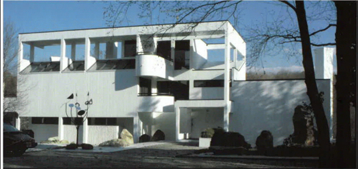 A white house with a balcony
