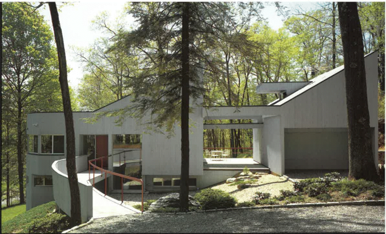 A house with a walkway and trees
 with medium confidence