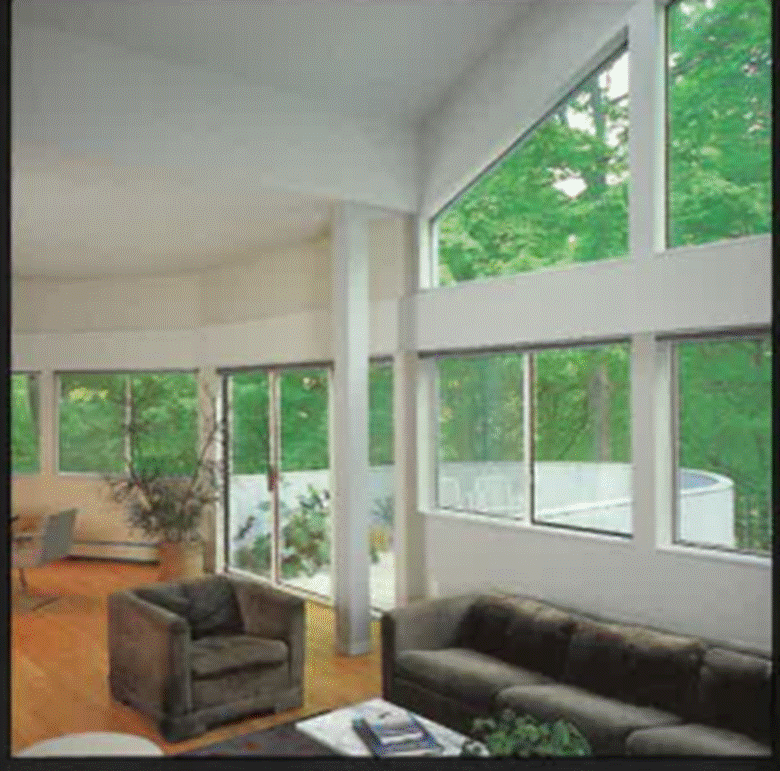 A living room with a large window
