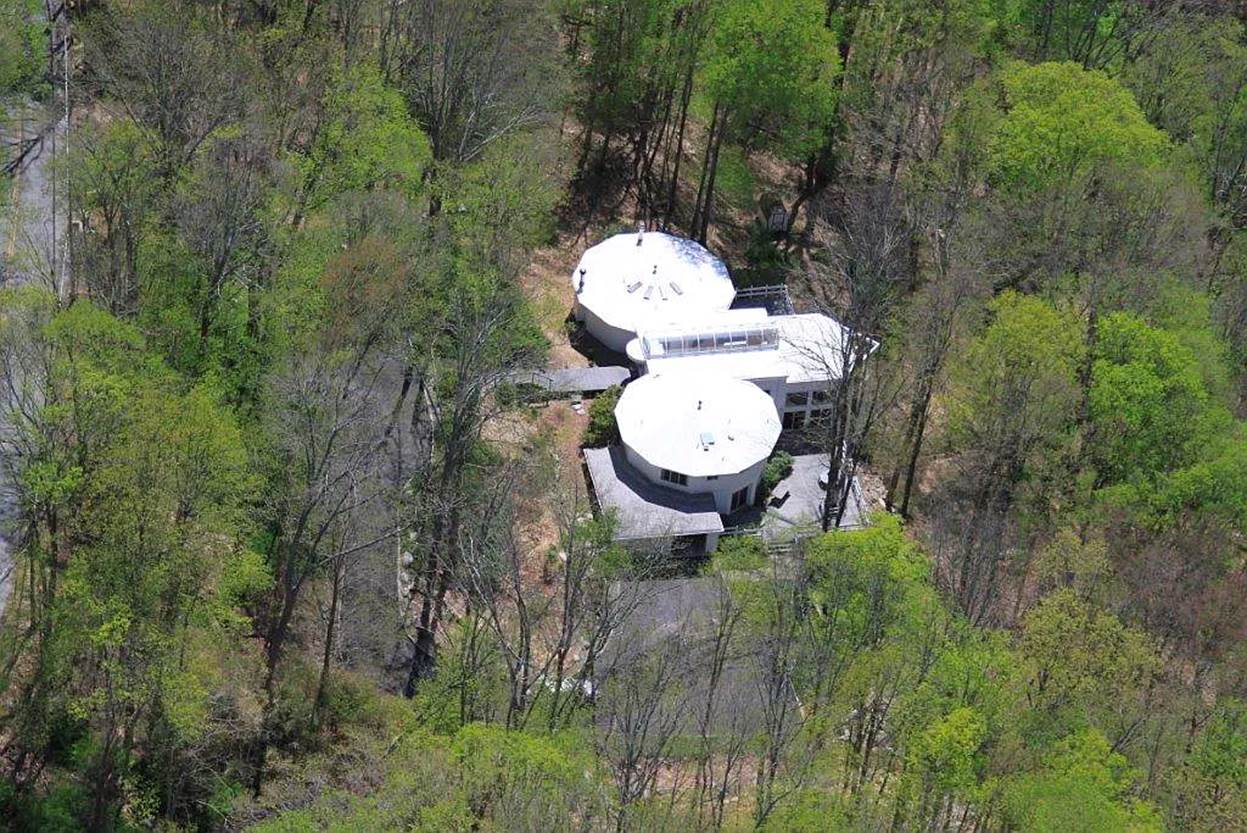 Aerial view of a building surrounded by trees
