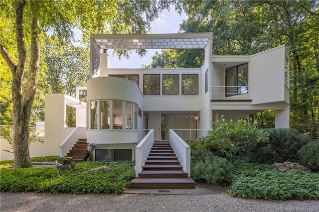 A house with a staircase leading to the front
