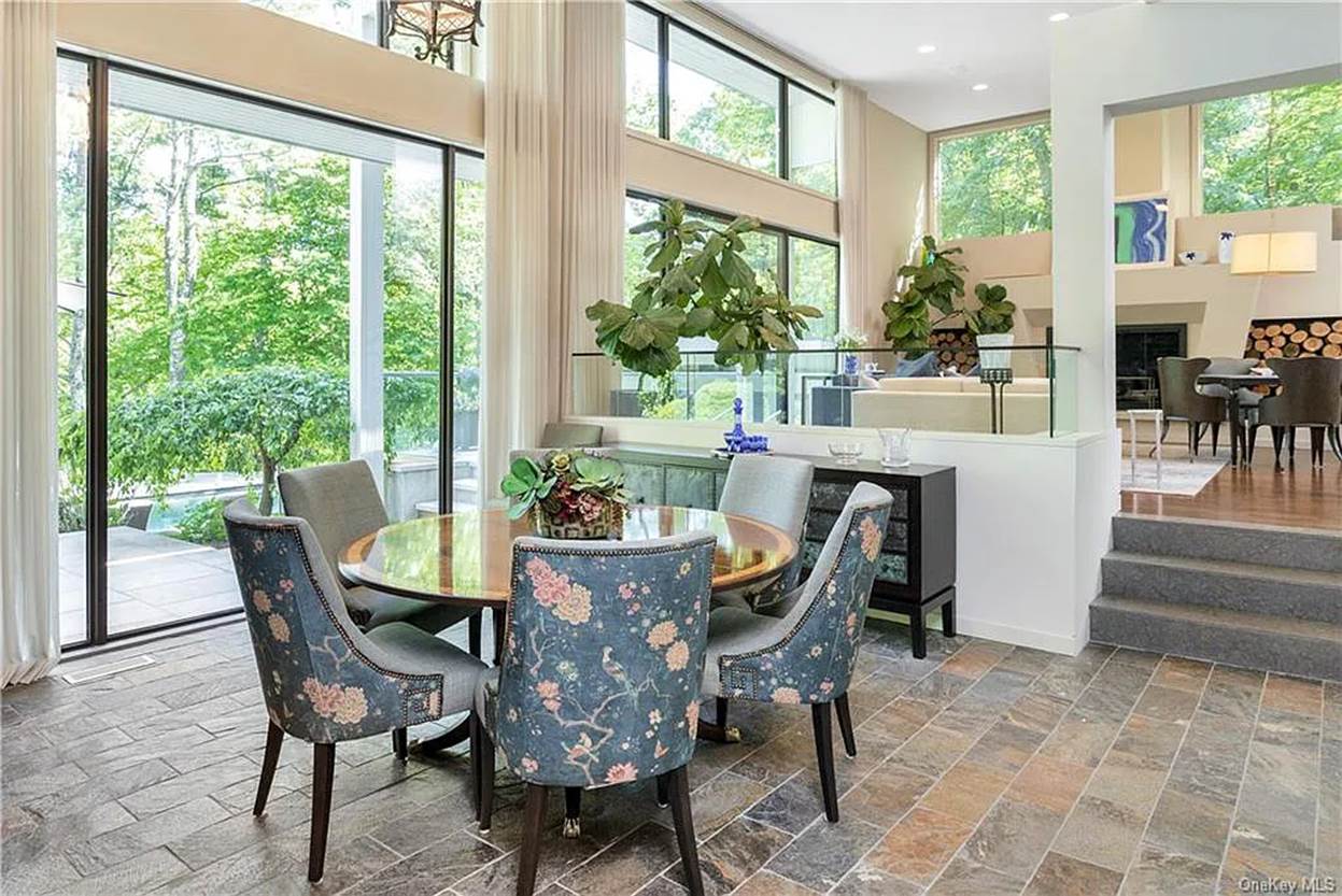 A dining room with a table and chairs
