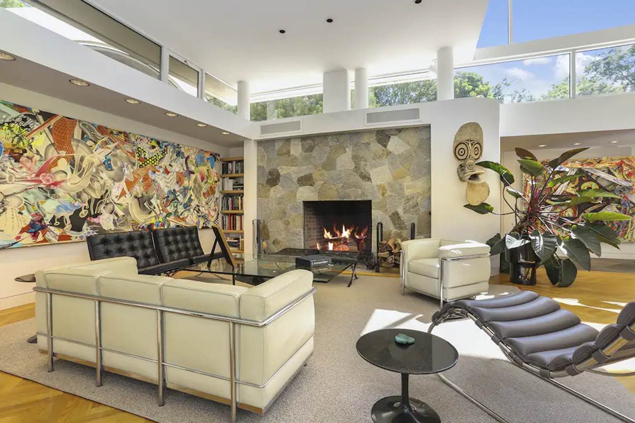 A living room with a fireplace and couches
