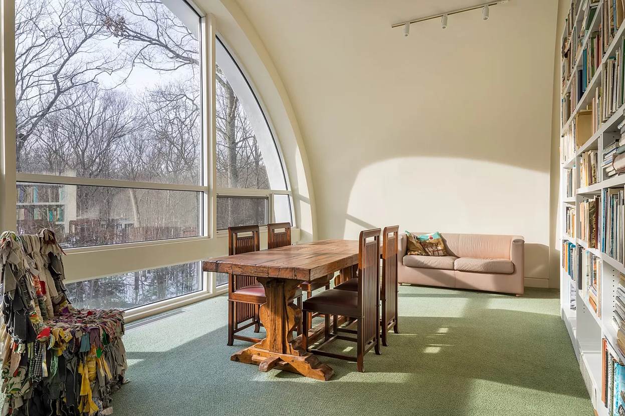 A room with a table and chairs
